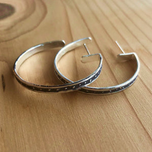 Handmade, large, unisex, sterling silver hoop earrings with etched starfield pattern. Chunky, handmade, unisex Torus ring with etched pattern. Unique designs for men and women by Jason Burton Designs jewelry.