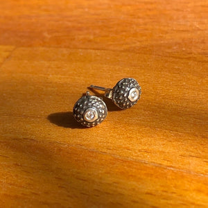 Handmade, unisex, sterling silver stud earrings, featuring beautiful etched patterns and set with moissanite gemstones. Jason Burton designs jewelry for women and men.