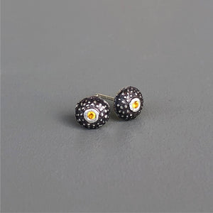 Handmade, unisex, sterling silver stud earrings, featuring beautiful etched patterns and set with natural yellow sapphires. Jason Burton designs jewelry for women and men.