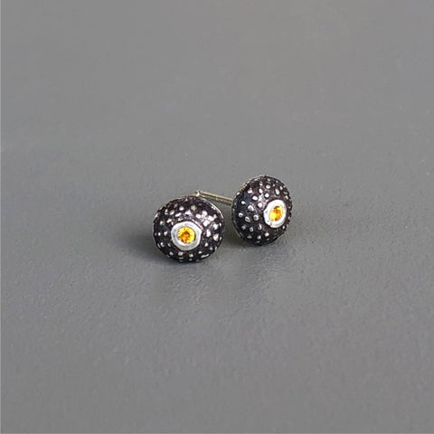 Handmade, unisex, sterling silver stud earrings, featuring beautiful etched patterns and set with natural yellow sapphires. Jason Burton designs jewelry for women and men.